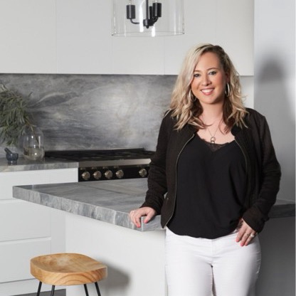 Stephanie Lloyd-Sassine, interior designer, in a marble kitchen